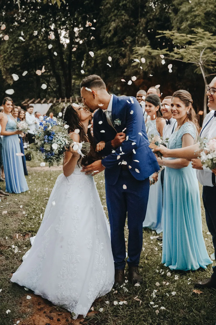 Bride and groom embracing outdoors